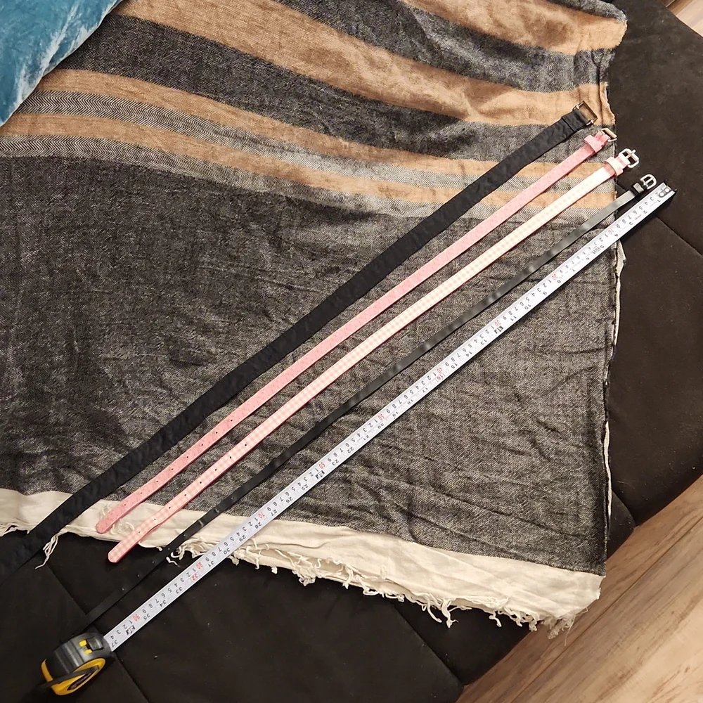 4 used belts printed pink and solid black